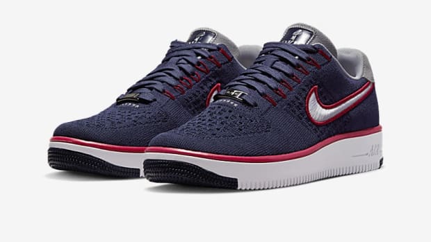 Blue, white, and red Nike Air Force 1 shoes.